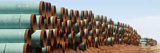 Miles of pipe for the Canada-to-Texas Keystone XL pipeline are stacked in a field near Ripley, Okla.