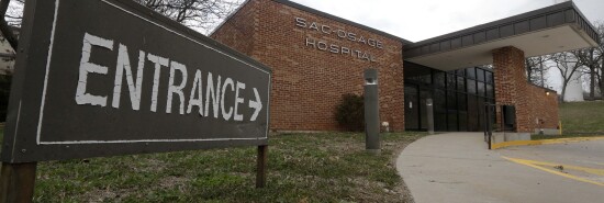 In this Wednesday, April 1, 2015 photo, closed and out of service, the entrance to Sac-Osage Hospital stands empty in Osceola, Mo. 