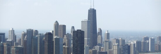 Sailboats practice in front of the downtown Chicago skyline.