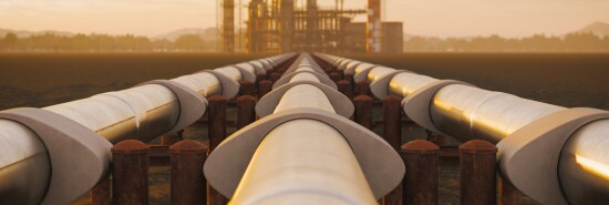 Oil Refinery And Pipeline In Desert During Sunset