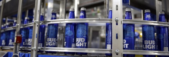 Aluminum Bud Light beer bottles move along a conveyor inside a facility that makes 16-ounce aluminum Budweiser and Bud Light bottles for Anheuser-Busch.