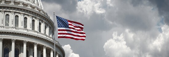 US Capitol and waving american flag