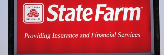 Illuminated State Farm Insurance sign with copy space