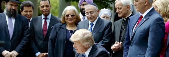 In this May 4, 2017 file photo, President Trump signs an executive order aimed at easing an IRS rule limiting political activity for religious organizations, in the Rose Garden of the White House in Washington.