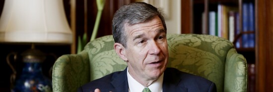 North Carolina Gov. Roy Cooper responds to a question during an interview at the governor's mansion in Raleigh, N.C.