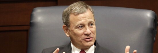 Supreme Court Chief Justice John Roberts answers questions during an event.