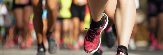 Marathon running race, runners feet on road