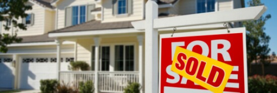 Sold Home For Sale Sign in Front of New House