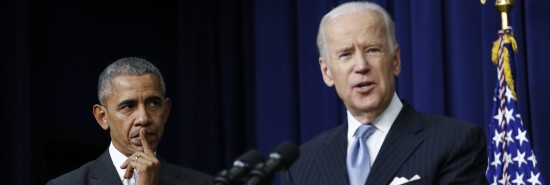 Barack Obama listens as Joe Biden speaks in the South Court Auditorium in the Eisenhower Executive Office Building on the White House complex in Washington.