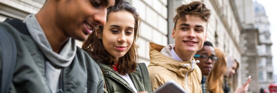 Teenagers students using smartphone on a school break