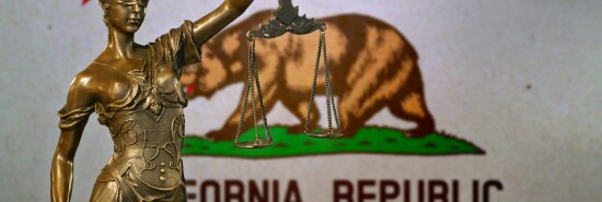 Lady Justice before a flag of California