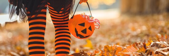 Little girl in Halloween costumes goes to trick or treating