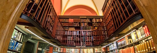 Shelves of books are seen in the Library of Congress Jefferson Building.